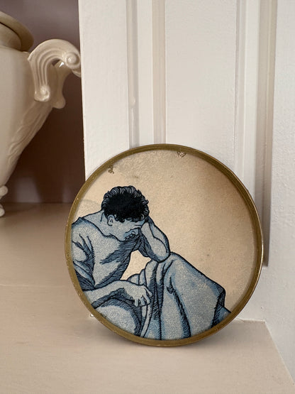 Mini shelfie: Thoughtful man in blue