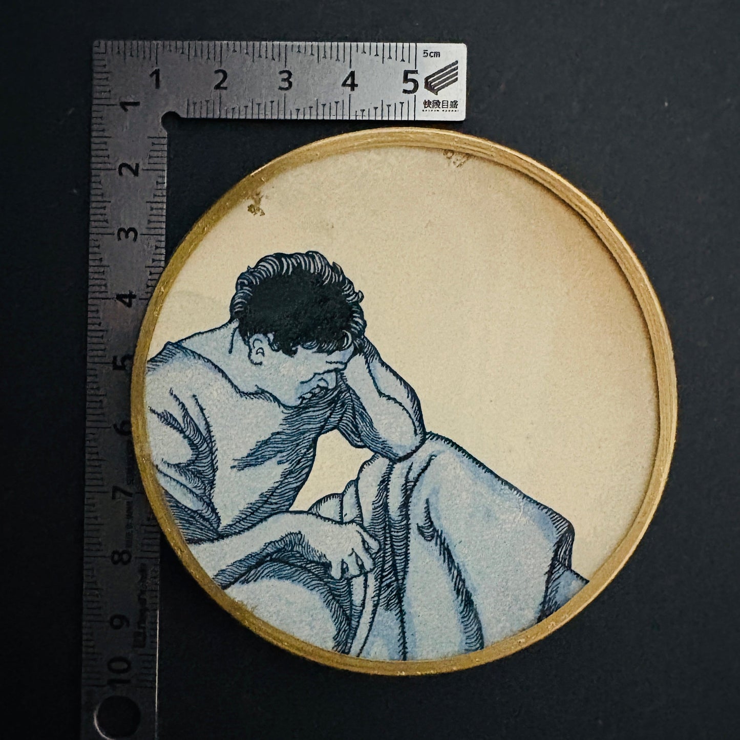 Mini shelfie: Thoughtful man in blue