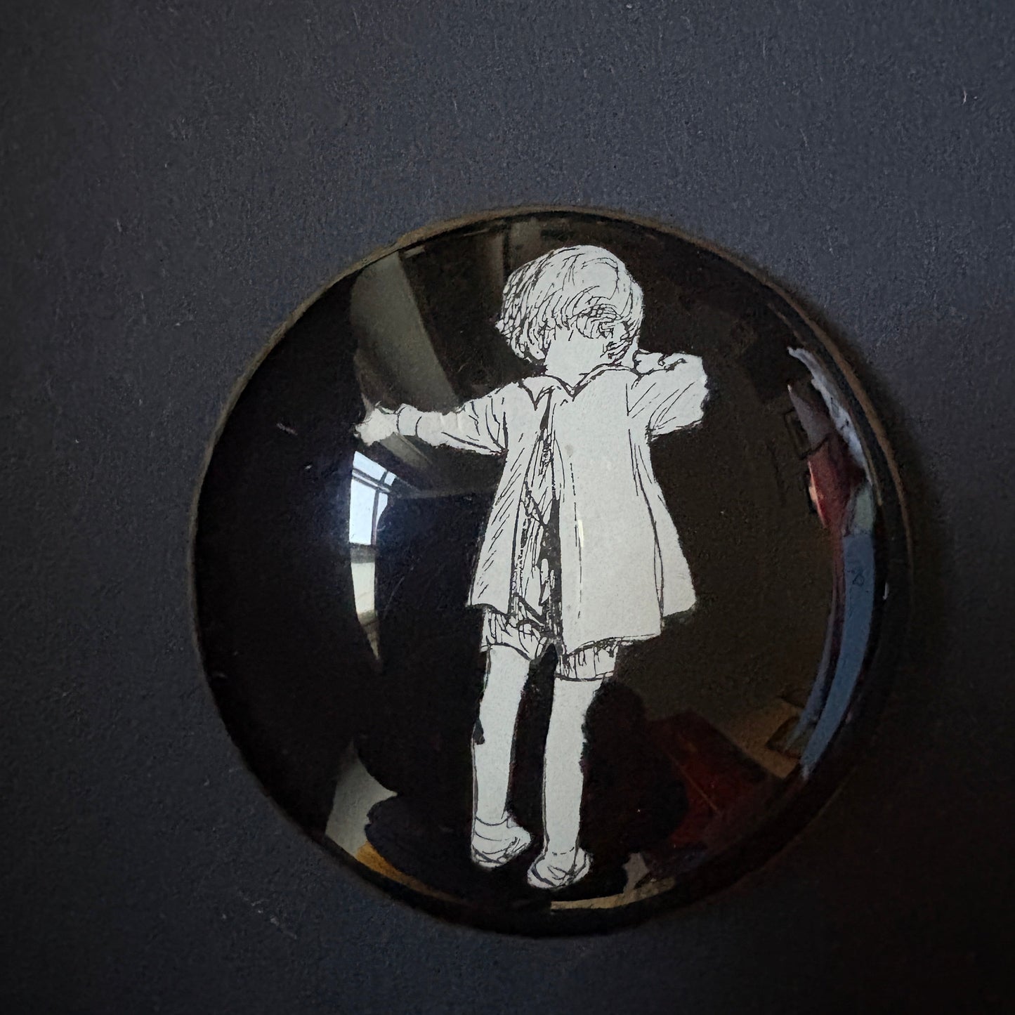 Variegated wink: Christopher Robin from behind on a black background