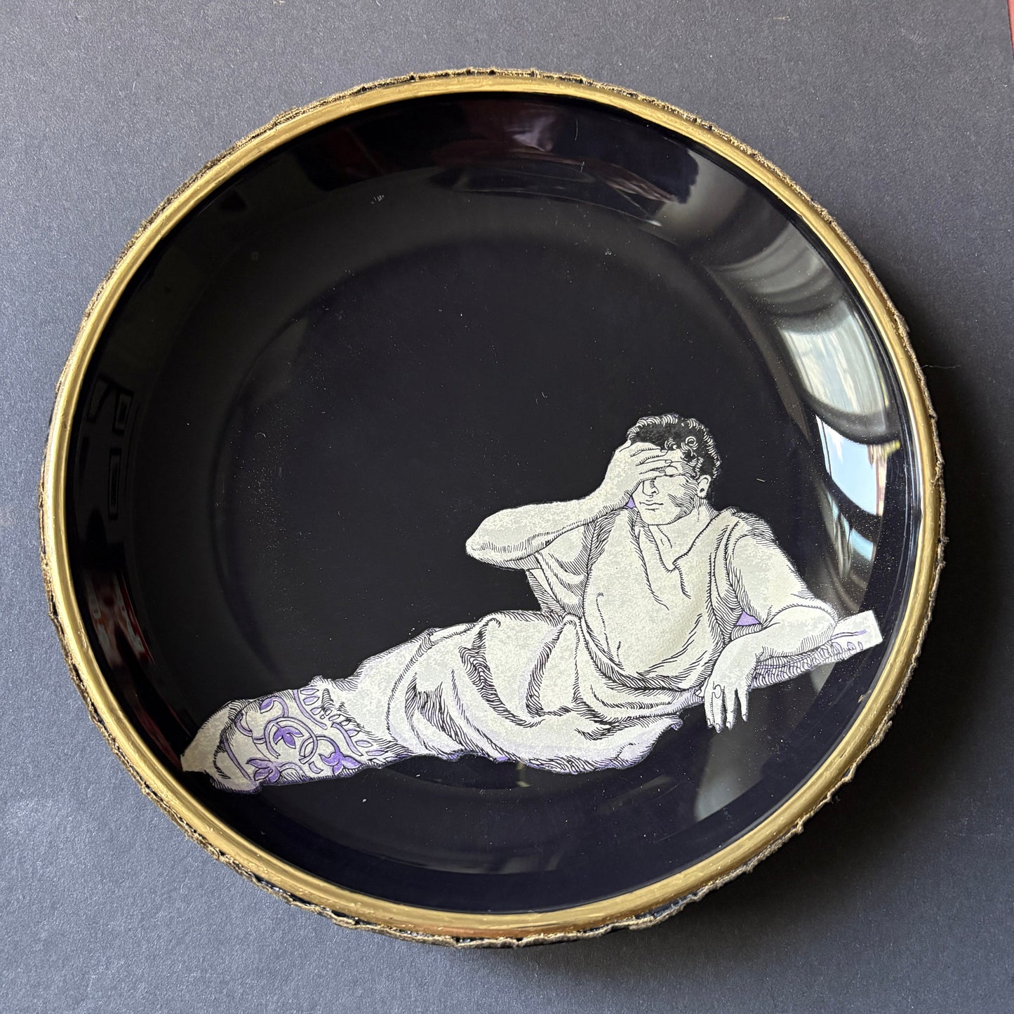 Shelfie: Ancient Roman man leaning on triclinium