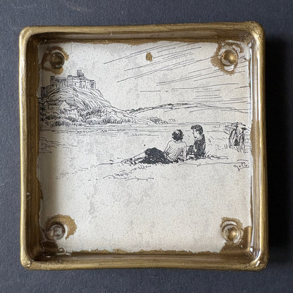 Shelfie: Two boys lying on the grass under the rock