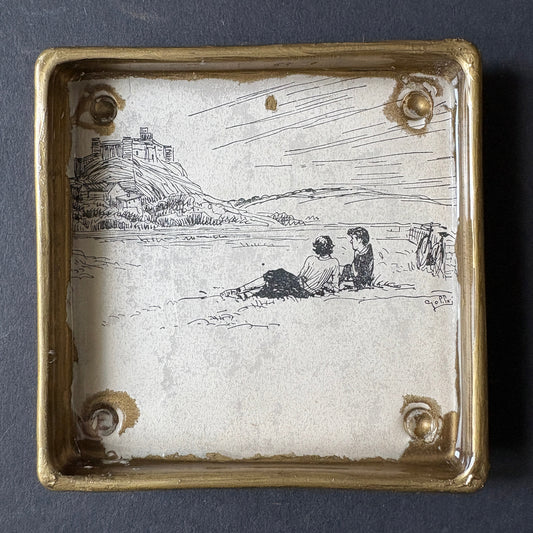 Shelfie: Two boys lying on the grass under the rock